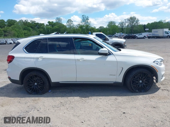 2017 BMW X5 xDrive35i z VIN 5UXKR0C30H0X79365, wystawiony jako IAAI lot #42209393 z przebiegiem Nie podano mil oraz . Historia ofert i sprzedaży dostępna na DreamBid. Obrazek 13.