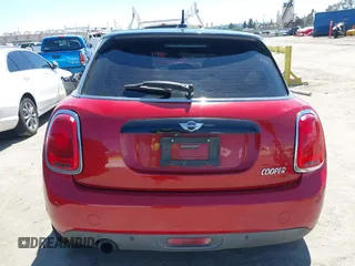 2017 MINI Hardtop 4 Door Cooper z VIN WMWXU1C57H2E18670, wystawiony jako IAAI lot #41950314 z przebiegiem 94 199 mil mil oraz . Historia ofert i sprzedaży dostępna na DreamBid. Obrazek 17.