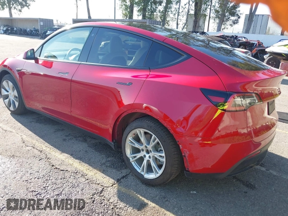 2020 Tesla Model Y Long Range with VIN 5YJYGDEE8LF057014, listed as a IAAI auction lot 41988113 with 18,246 mi miles and . Bid and sale history available at DreamBid. Image 3.