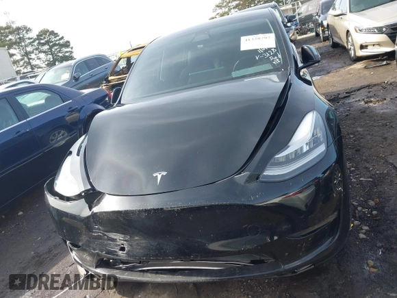 2023 Tesla Model Y Long Range z VIN 7SAYGAEE5PF603128, wystawiony jako IAAI lot #41328797 z przebiegiem 63 527 mil mil oraz . Historia ofert i sprzedaży dostępna na DreamBid. Obrazek 12.