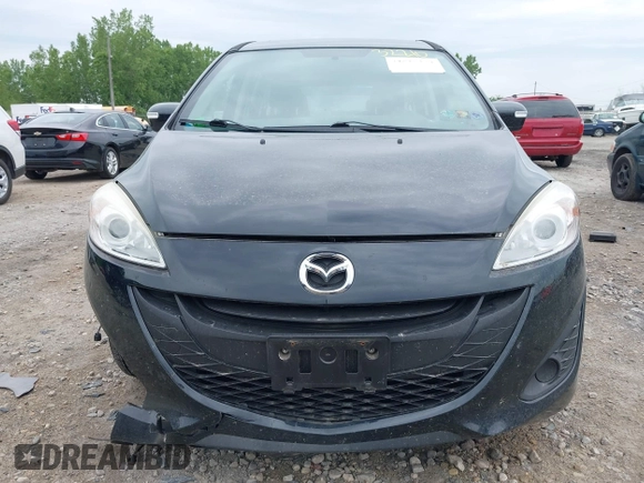 2015 Mazda 5 Sport with VIN JM1CW2BL2F0190990, listed as a IAAI auction lot 42532210 with 98,528 mi miles and . Bid and sale history available at DreamBid. Image 12.