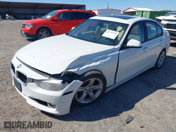 2014 BMW 3 Series 320i with VIN WBA3B1C59EP678908, listed as a IAAI auction lot 41774738 with 143,975 mi miles. Bid and sale history available at carsss.com. Image 2.