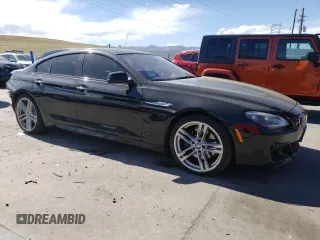 2015 BMW 6 Series 650i xDrive with VIN WBA6B4C55FD761124, listed as a Copart auction lot 50559555 with 49,735 mi miles and Salvage Title. Bid and sale history available at DreamBid. Image 4.