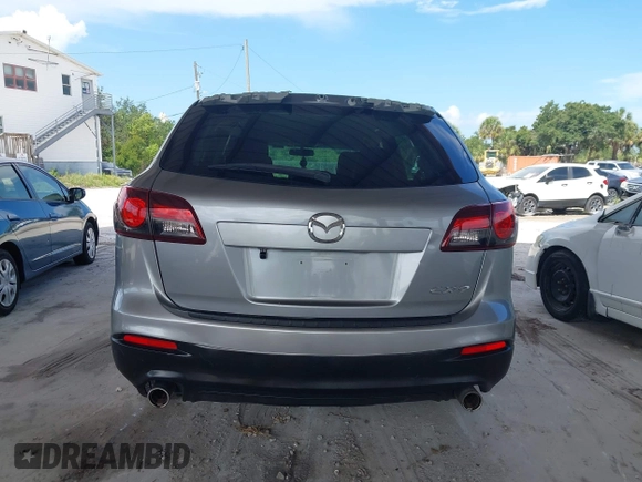 2015 Mazda CX-9 Sport with VIN JM3TB2BA0F0447436, listed as a IAAI auction lot 42480482 with 127,557 mi miles and . Bid and sale history available at DreamBid. Image 16.