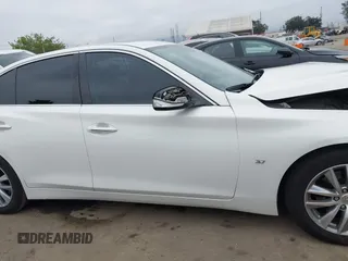 2015 Infiniti Q50 Premium z VIN JN1BV7AP2FM344044, wystawiony jako IAAI lot #42217012 z przebiegiem 155 714 mil mil oraz . Historia ofert i sprzedaży dostępna na DreamBid. Obrazek 13.