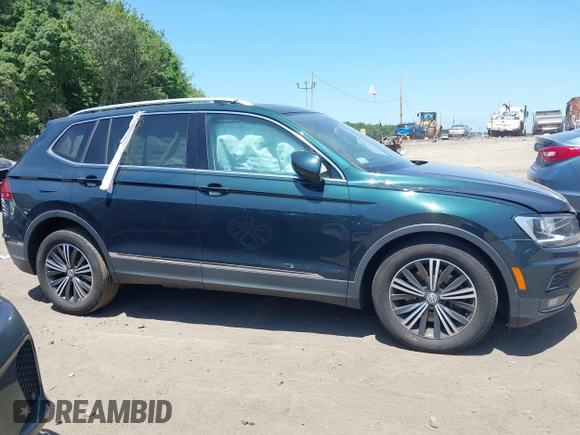 2018 Volkswagen Tiguan SEL with VIN 3VV2B7AX9JM058518, listed as a IAAI auction lot 42558129 with 82,807 mi miles and . Bid and sale history available at DreamBid. Image 13.