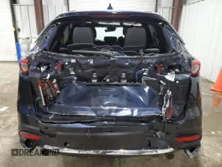 2023 Mazda CX-9 Grand Touring with VIN JM3TCBDY1P0630868, listed as a Copart auction lot 56321205 with 50,427 mi miles and Salvage title. Bid and sale history available at DreamBid. Image 6.