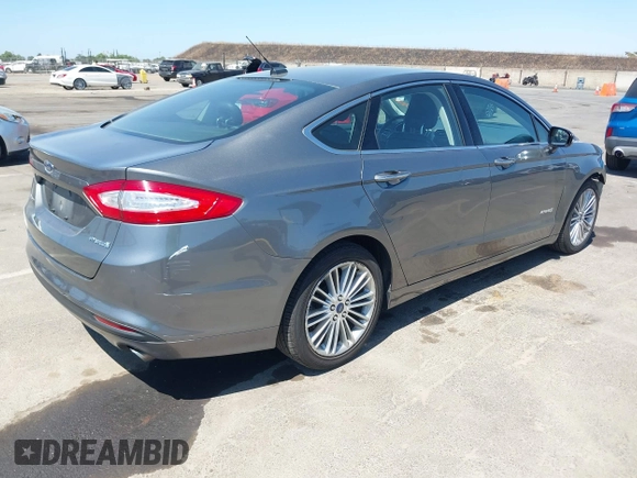 2014 Ford Fusion SE Hybrid with VIN 3FA6P0LU5ER393530, listed as a IAAI auction lot 42478440 with 93,728 mi miles and . Bid and sale history available at DreamBid. Image 4.