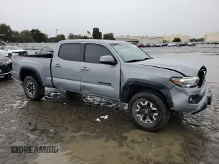 2021 Toyota Tacoma 4WD SR5 with VIN 3TMDZ5BN5MM098717, listed as a Copart auction lot 43877975 with 21,328 mi miles and Salvage Title. Bid and sale history available at carsss.com. Image 4.