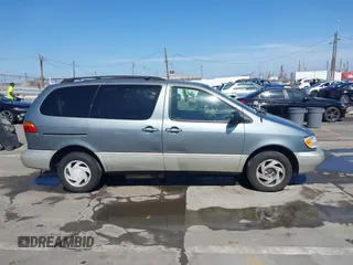 1999 Toyota Sienna LE with VIN 4T3ZF13C5XU099020, listed as a IAAI auction lot 41709287 with 206,884 mi miles. Bid and sale history available at carsss.com. Image 13.