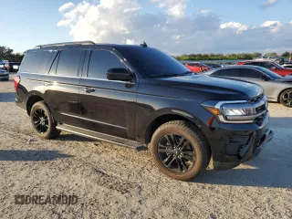 2024 Ford Expedition XLT with VIN 1FMJU1H84REA95604, listed as a Copart auction lot 86878914 with 4,977 mi miles and Salvage Title. Bid and sale history available at carsss.com. Image 4.