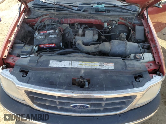 2000 Ford F-150 XL with VIN 1FTZX1728YNA87502, listed as a Copart auction lot 54870295 with 219,971 mi miles and Salvage title. Bid and sale history available at DreamBid. Image 11.