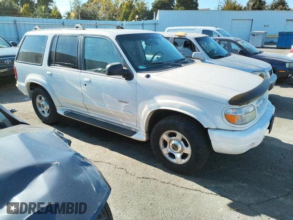 1999 Ford Explorer XLT with VIN 1FMZU34E8XZB27387, listed as a Copart auction lot 74398364 with 211,520 mi miles and Clean title. Bid and sale history available at DreamBid. Image 4.