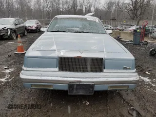 1989 Chrysler New Yorker z VIN 1C3BC4632KD549983, wystawiony jako Copart lot #44415435 z przebiegiem 44 683 mil mil oraz Szkody całkowita. Historia ofert i sprzedaży dostępna na DreamBid. Obrazek 5.