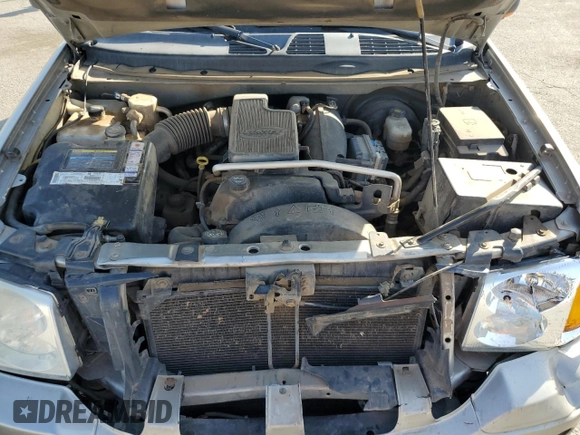 2003 GMC Envoy SLE with VIN 1GKDS13S332390989, listed as a Copart auction lot 74729104 with 127,680 mi miles and Salvage Title. Bid and sale history available at DreamBid. Image 12.