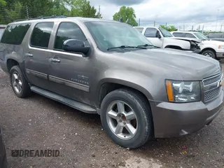 2011 Chevrolet Suburban LT with VIN 1GNSCJE03BR267184, listed as a IAAI auction lot 42156424 with 307,618 mi miles. Bid and sale history available at carsss.com. Image 1.