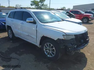 2014 Jeep Grand Cherokee Overland with VIN 1C4RJFCTXEC128443, listed as a IAAI auction lot 40512681 with 126,379 mi miles. Bid and sale history available at carsss.com. Image 1.
