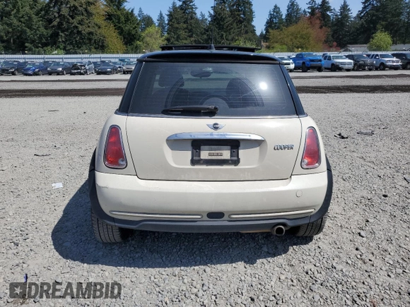 2006 MINI Hardtop with VIN WMWRC33586TJ77908, listed as a Copart auction lot 55095525 with 143,810 mi miles and Salvage title. Bid and sale history available at DreamBid. Image 6.