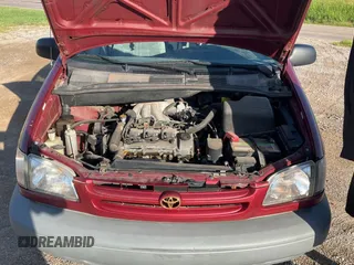 1999 Toyota Sienna LE with VIN 4T3ZF13C5XU141279, listed as a Copart auction lot 64366315 with 218,223 mi miles and Clean title. Bid and sale history available at DreamBid. Image 7.