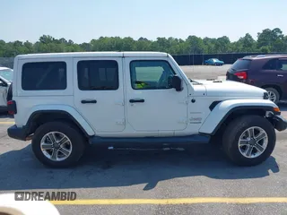 2018 Jeep Wrangler Unlimited Sahara with VIN 1C4HJXEG6JW112976, listed as a IAAI auction lot 42559123 with 76,066 mi miles and . Bid and sale history available at DreamBid. Image 13.