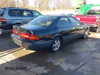 1997 Lexus ES 300 Luxury Sport Sdn with VIN JT8BF22GXV5003056, listed as a IAAI auction lot 41806886 with 130,063 mi miles. Bid and sale history available at carsss.com. Image 4.