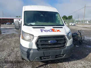 2020 Ford Transit Cargo z VIN 1FTBR1C87LKA51039, wystawiony jako IAAI lot #42212523 z przebiegiem 183 020 mil mil oraz . Historia ofert i sprzedaży dostępna na DreamBid. Obrazek 12.