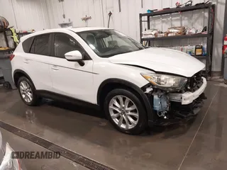 2015 Mazda CX-5 Grand Touring with VIN JM3KE4DY4F0495627, listed as a IAAI auction lot 41887773 with 130,421 mi miles. Bid and sale history available at carsss.com. Image 1.