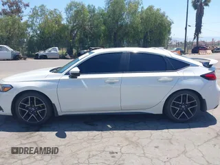 2022 Honda Civic Sport Touring z VIN 19XFL1G82NE000678, wystawiony jako IAAI lot #42221847 z przebiegiem 90 869 mil mil oraz . Historia ofert i sprzedaży dostępna na DreamBid. Obrazek 14.