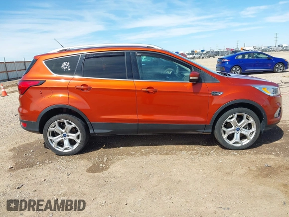 2019 Ford Escape Titanium with VIN 1FMCU9J92KUB28895, listed as a IAAI auction lot 42065235 with 112,305 mi miles and . Bid and sale history available at DreamBid. Image 13.