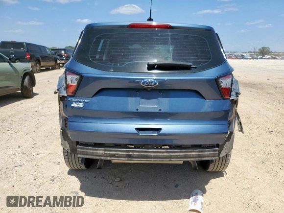 2018 Ford Escape S with VIN 1FMCU0F77JUC79457, listed as a Copart auction lot 59812235 with 54,272 mi miles and Salvage title. Bid and sale history available at DreamBid. Image 6.