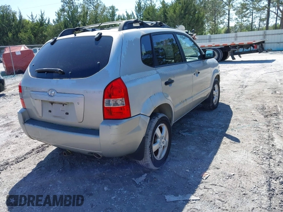 2006 Hyundai Tucson GL with VIN KM8JM12BX6U249982, listed as a IAAI auction lot 41976033 with 107,153 mi miles. Bid and sale history available at carsss.com. Image 4.