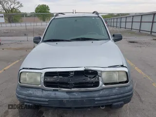 2003 Chevrolet Tracker z VIN 2CNBE134736919970, wystawiony jako IAAI lot #42203446 z przebiegiem 158 872 mil mil oraz . Historia ofert i sprzedaży dostępna na DreamBid. Obrazek 12.