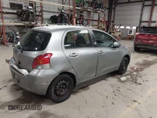 2009 Toyota Yaris with VIN JTDKT903695262863, listed as a IAAI auction lot 41456767 with 206,534 mi miles and . Bid and sale history available at DreamBid. Image 4.