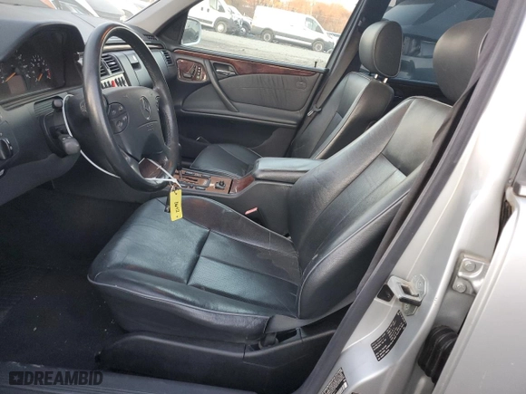 2000 Mercedes-Benz E-Class with VIN WDBJF70J7YB049473, listed as a Copart auction lot 82396624 with 197,515 mi miles and Salvage Title. Bid and sale history available at carsss.com. Image 7.