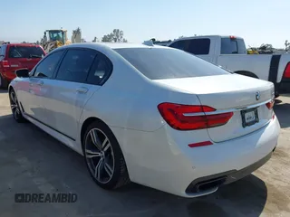 2019 BMW 7 Series 750i with VIN WBA7F0C5XKGM25771, listed as a IAAI auction lot 42167614 with 73,692 mi miles. Bid and sale history available at carsss.com. Image 3.