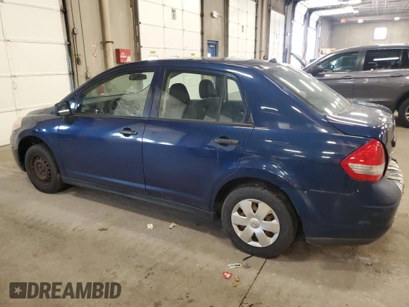2009 Nissan Versa 1.6 with VIN 3N1CC11E49L458857, listed as a Copart auction lot 59195275 with 100,351 mi miles and Salvage title. Bid and sale history available at DreamBid. Image 2.
