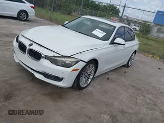 2012 BMW 3 Series 328i with VIN WBA3A5C57CF347953, listed as a IAAI auction lot 42176008 with 140,598 mi miles and . Bid and sale history available at carsss.com. Image 2.