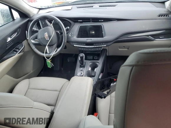 2022 Cadillac XT4 FWD Premium Luxury z VIN 1GYFZCR44NF166169, wystawiony jako Copart lot #77981414 z przebiegiem 9 734 mil mil oraz Nie do naprawy • Non repairable. Historia ofert i sprzedaży dostępna na DreamBid. Obrazek 8.
