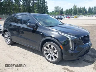2019 Cadillac XT4 AWD Sport z VIN 1GYFZFR48KF119062, wystawiony jako IAAI lot #42449132 z przebiegiem 89 676 mil mil oraz . Historia ofert i sprzedaży dostępna na DreamBid. Obrazek 1.