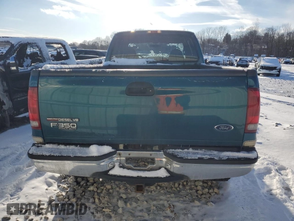 2000 Ford F-350 XL with VIN 1FTSX31F9YEB88587, listed as a Copart auction lot 45626735 with 123,973 mi miles and Salvage Title. Bid and sale history available at DreamBid. Image 6.