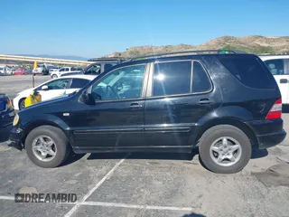 2001 Mercedes-Benz M-Class with VIN 4JGAB54E01A272539, listed as a IAAI auction lot 42124321 with 272,098 mi miles. Bid and sale history available at carsss.com. Image 14.