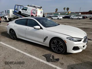 2023 BMW 8 Series 840i with VIN WBAGV4C04PCK51113, listed as a Copart auction lot 52495763 with 17,688 mi miles. Bid and sale history available at carsss.com. Image 4.