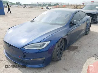 2021 Tesla Model S Plaid with VIN 5YJSA1E64MF442036, listed as a IAAI auction lot 42141304 with 24,998 mi miles and . Bid and sale history available at DreamBid. Image 2.