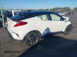2021 Toyota C-HR LE with VIN JTNKHMBXXM1105546, listed as a IAAI auction lot 41486068 with 87,099 mi miles. Bid and sale history available at carsss.com. Image 4.