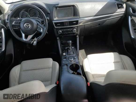 2016 Mazda CX-5 Grand Touring with VIN JM3KE4DY3G0688286, listed as a Copart auction lot 52182205 with 194,352 mi miles and Salvage Title. Bid and sale history available at DreamBid. Image 8.