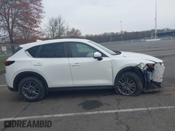 2017 Mazda CX-5 Touring with VIN JM3KFACL5H0189296, listed as a IAAI auction lot 42042328 with 60,208 mi miles and . Bid and sale history available at carsss.com. Image 13.