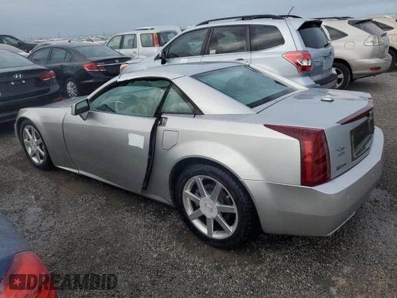 2004 Cadillac XLR z VIN 1G6YV34A545602056, wystawiony jako Copart lot #66506514 z przebiegiem Nie podano mil oraz Nie do naprawy • Non repairable. Historia ofert i sprzedaży dostępna na DreamBid. Obrazek 2.
