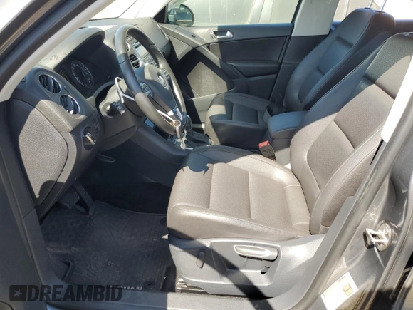 2014 Volkswagen Tiguan SEL with VIN WVGAV3AX8EW585929, listed as a Copart auction lot 61462205 with 63,899 mi miles and Salvage title. Bid and sale history available at DreamBid. Image 7.