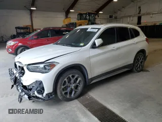 2020 BMW X1 xDrive28i with VIN WBXJG9C00L5P42487, listed as a Copart auction lot 59669325 with 88,402 mi miles and Salvage title. Bid and sale history available at DreamBid. Image 1.
