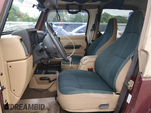 2001 Jeep Wrangler Sahara z VIN 1J4FA59SX1P305100, wystawiony jako Copart lot #58606685 z przebiegiem 76 856 mil mil oraz Czysty tytuł • Clean title. Historia ofert i sprzedaży dostępna na DreamBid. Obrazek 7.